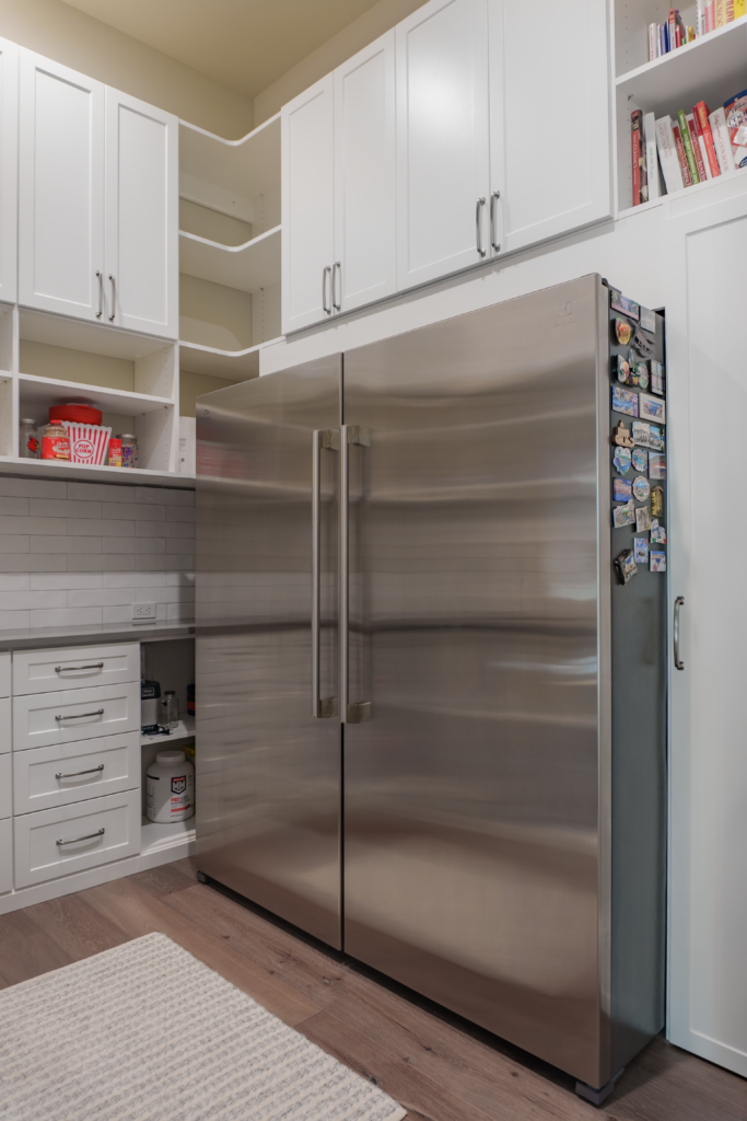 Photo of the pantry with a large fridge and freezer